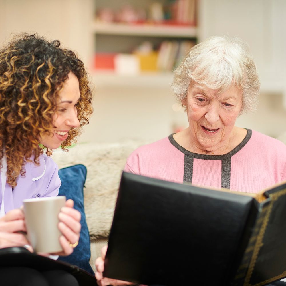 memory care resident looking at photobook
