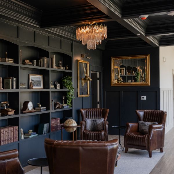 sophisticated library and lounge for resident social gatherings